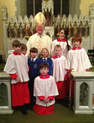 Bishop Michael with altar servers and school children